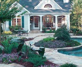 flower-beds-stone-patio-pavers-backyard-ideas
